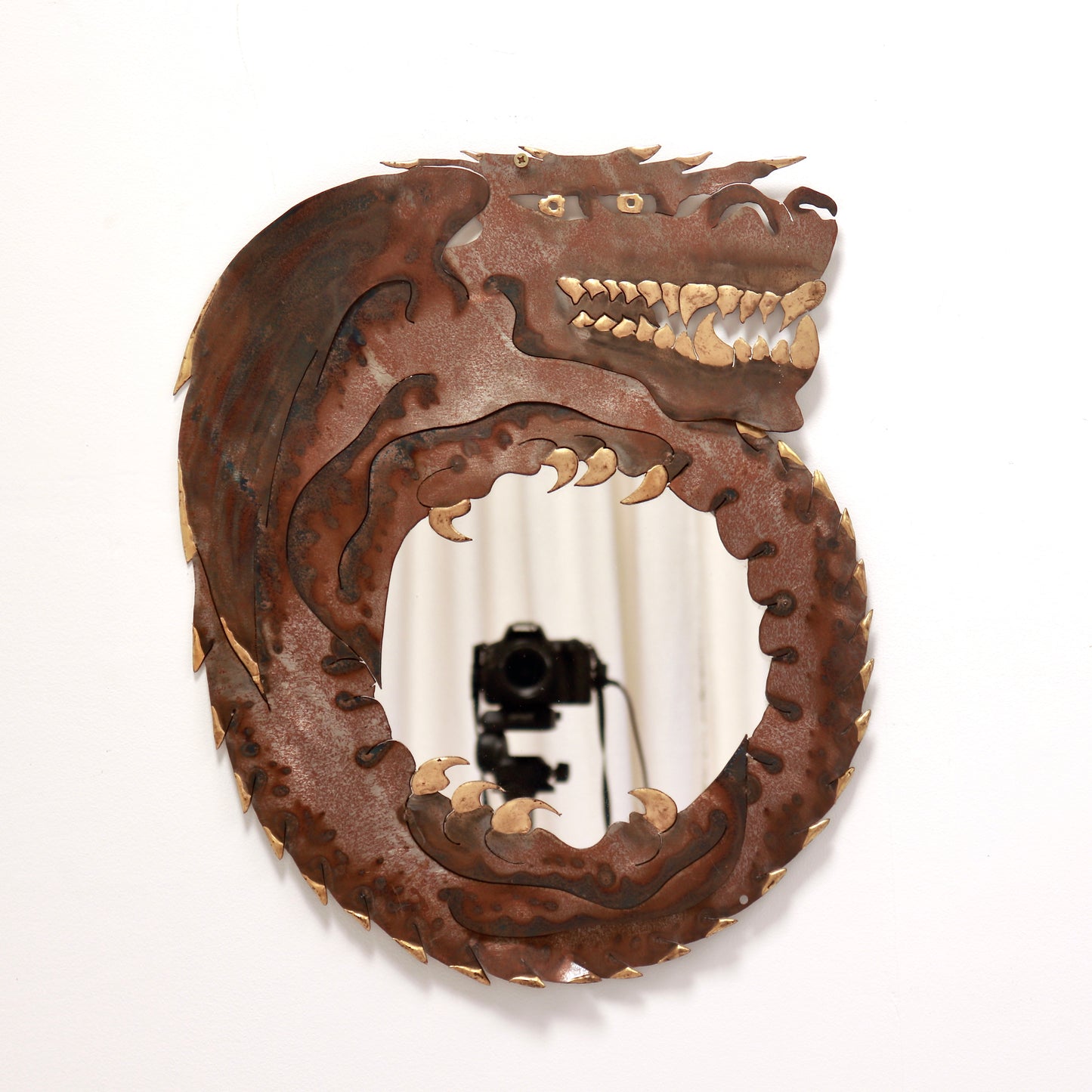 Vintage sculptural steel dragon wall mirror with oxidised finish