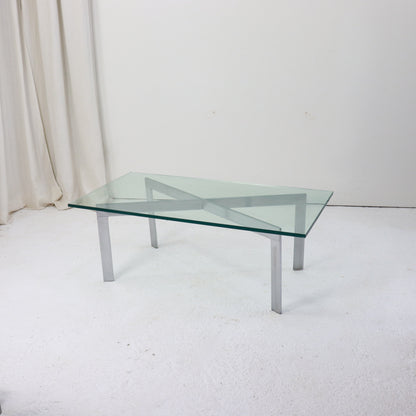 Modernist glass and nickel coffee table with X-frame base