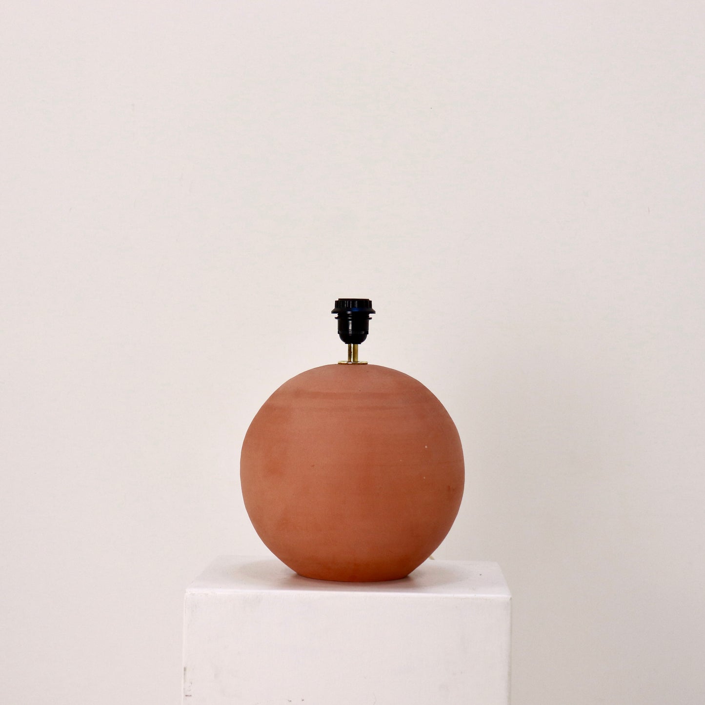 Side view of spherical terracotta base