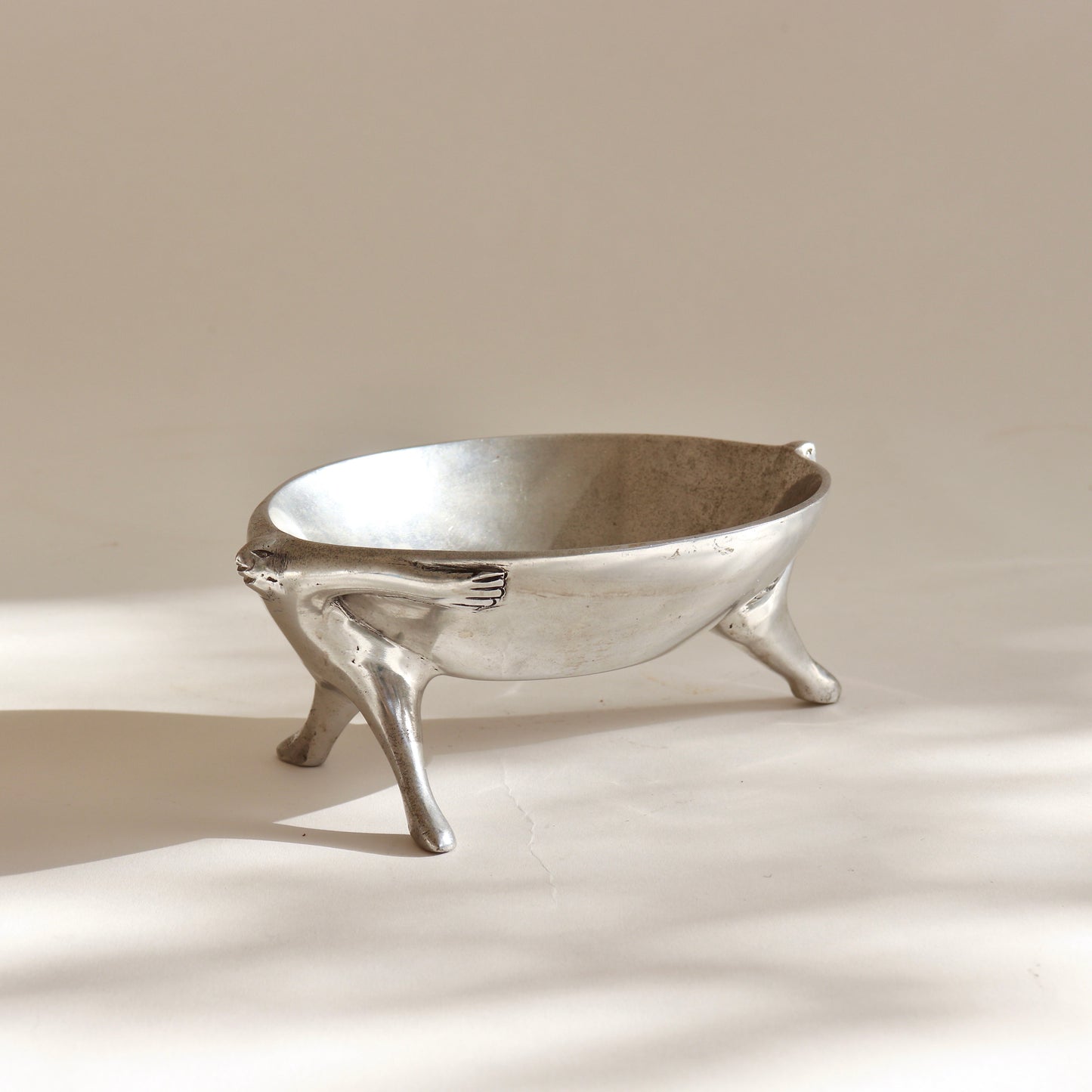 Carol Boyes cast aluminium dish with figural base