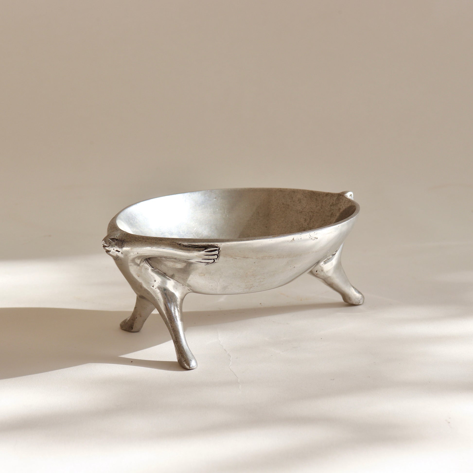 Carol Boyes cast aluminium dish with figural base