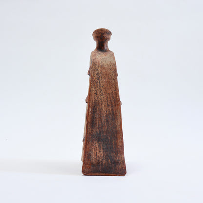 Side profile of a mid-century Cornish pottery vessel showing its shallow depth, tapering body and narrow neck.