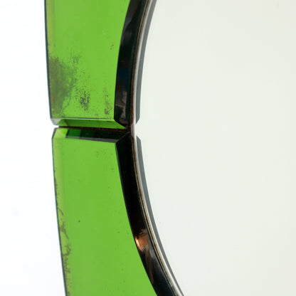 Detail of age-related spotting to the green mirrored glass