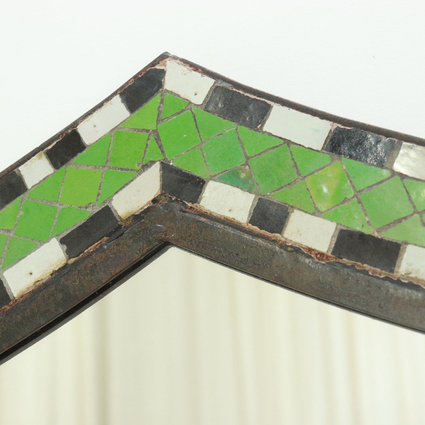 Detail showing hand-cut mosaic pattern and patina