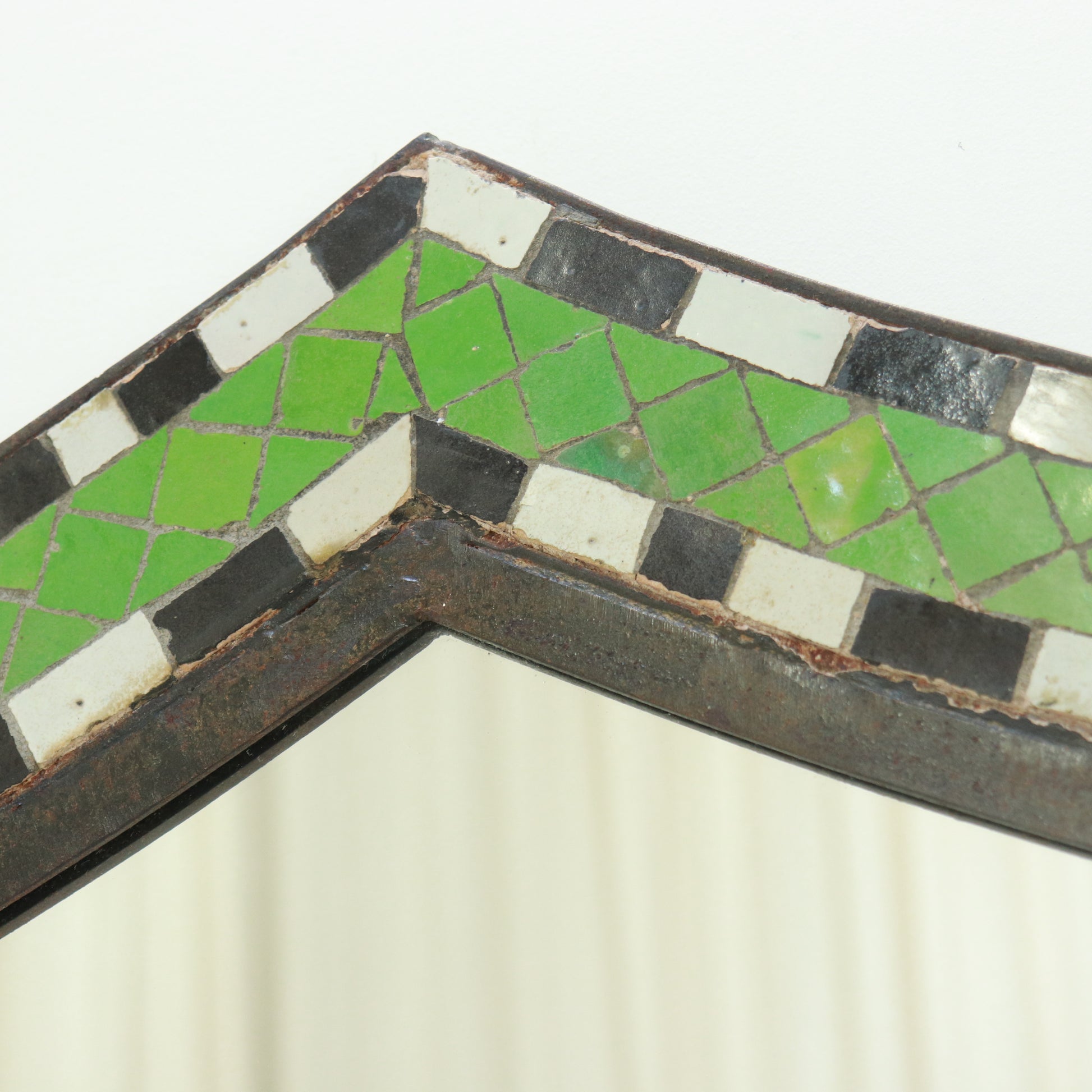 Detail showing hand-cut mosaic pattern and patina