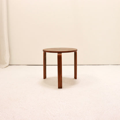 Minimal three-leg wooden table with curved legs