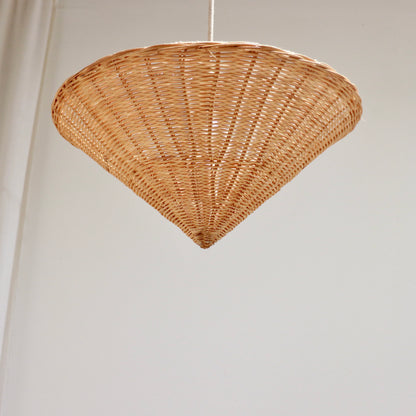 Single vintage rattan cone pendant light photographed from below