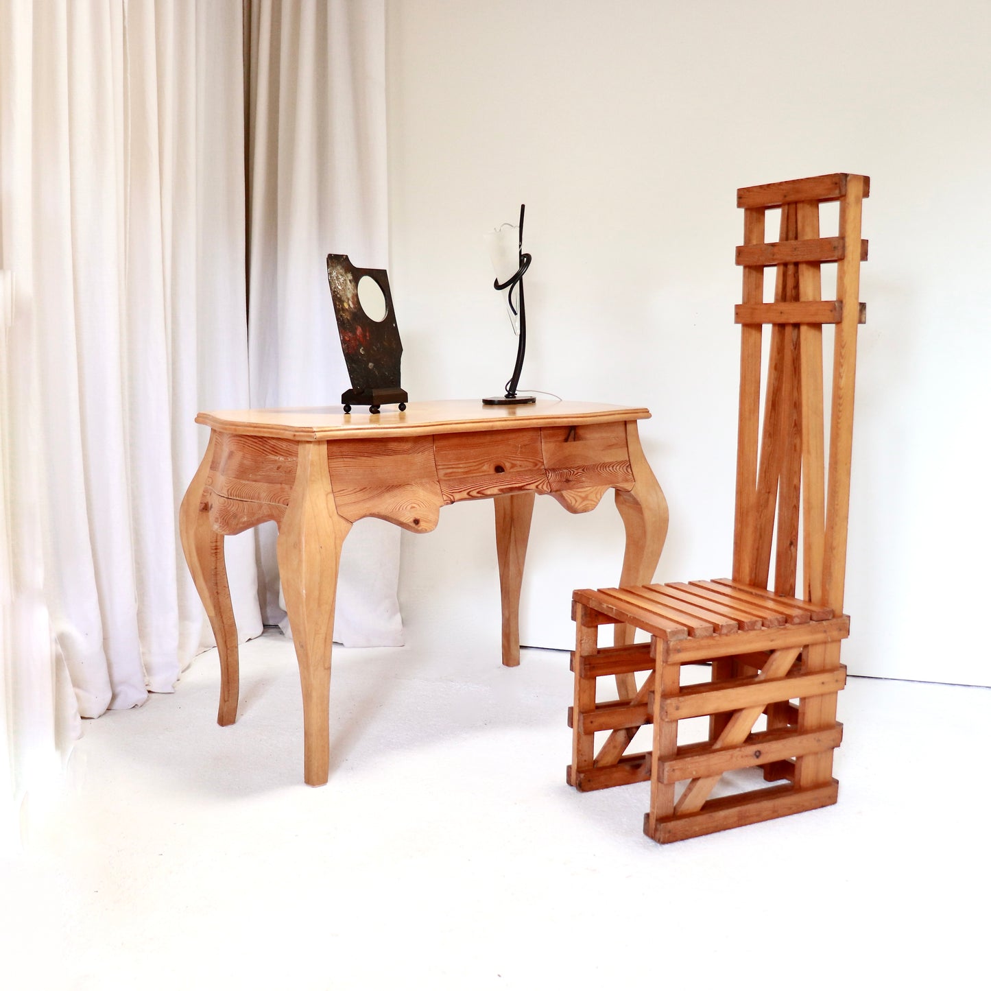 Full desk view styled with sculptural chair