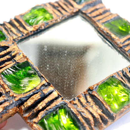 Detail of green Murano glass pieces set into the scored resin frame