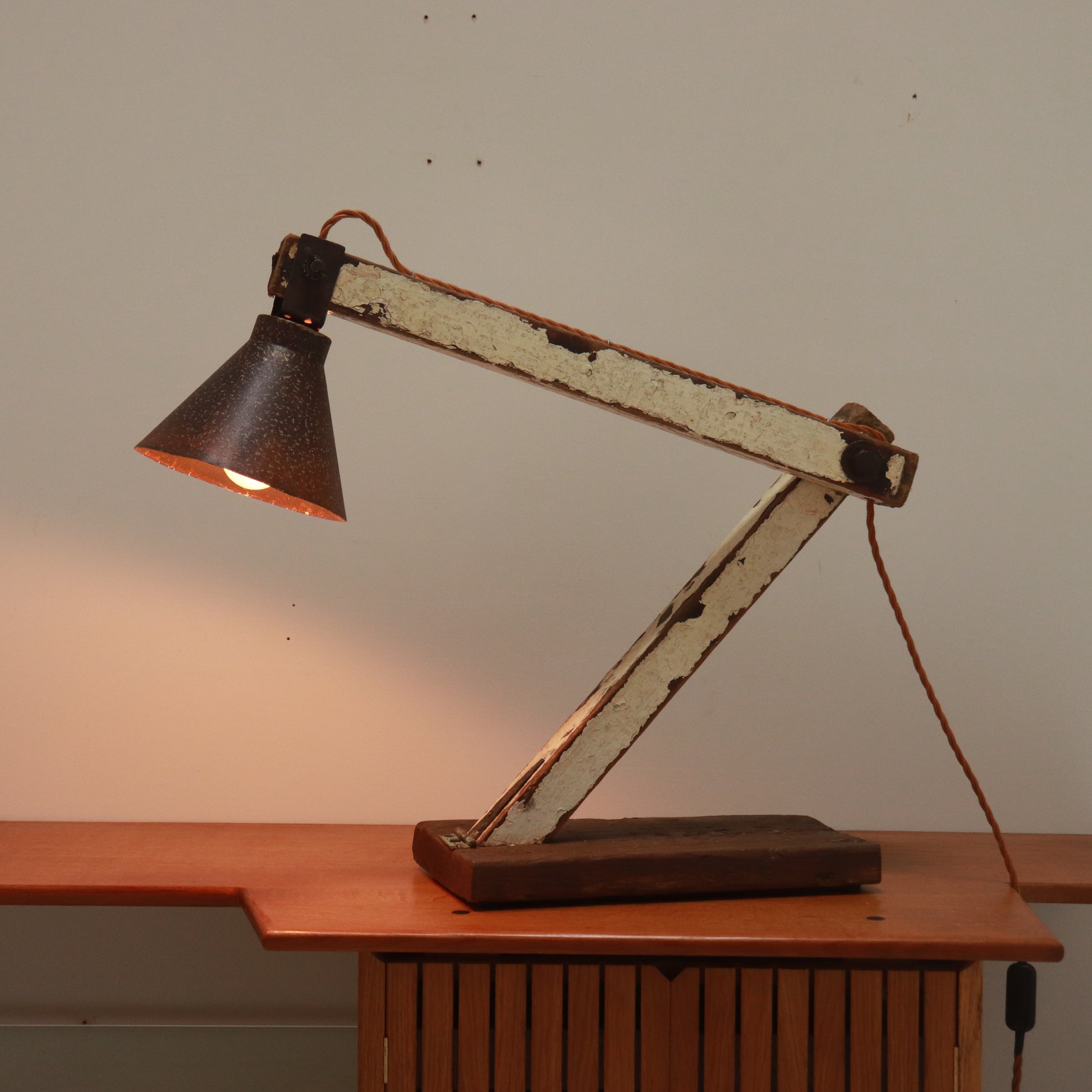 Side profile of early 20th-century folk art lamp