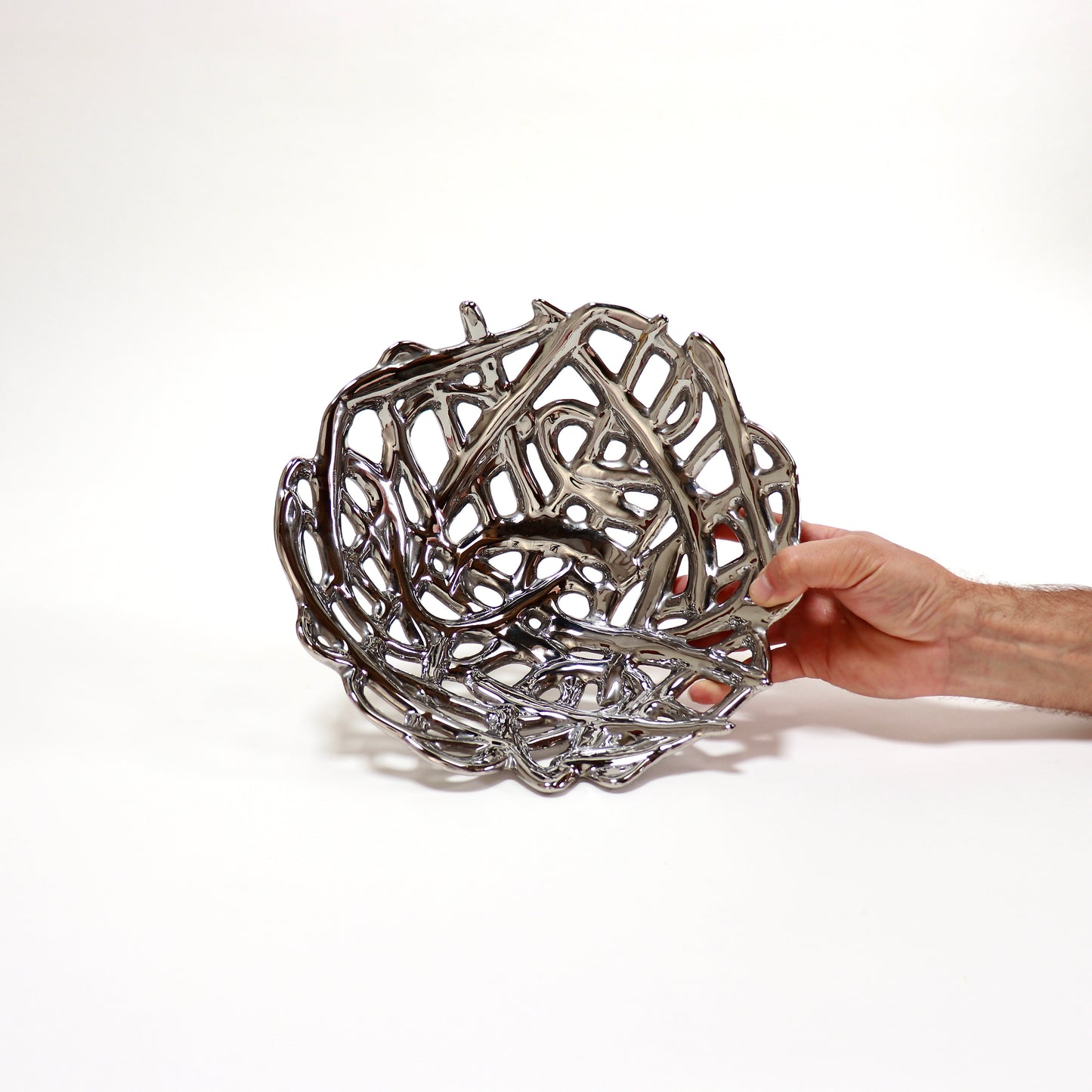 Chrome-glazed openwork ceramic bowl with sculptural lattice design