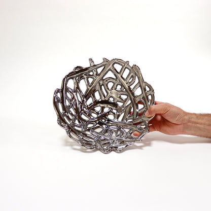 Chrome-glazed openwork ceramic bowl with sculptural lattice design