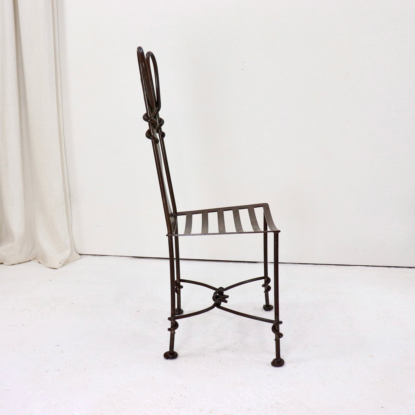 Side profile of handmade wrought iron chair