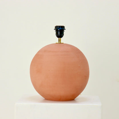 Minimal modern rustic table lamp on white plinth