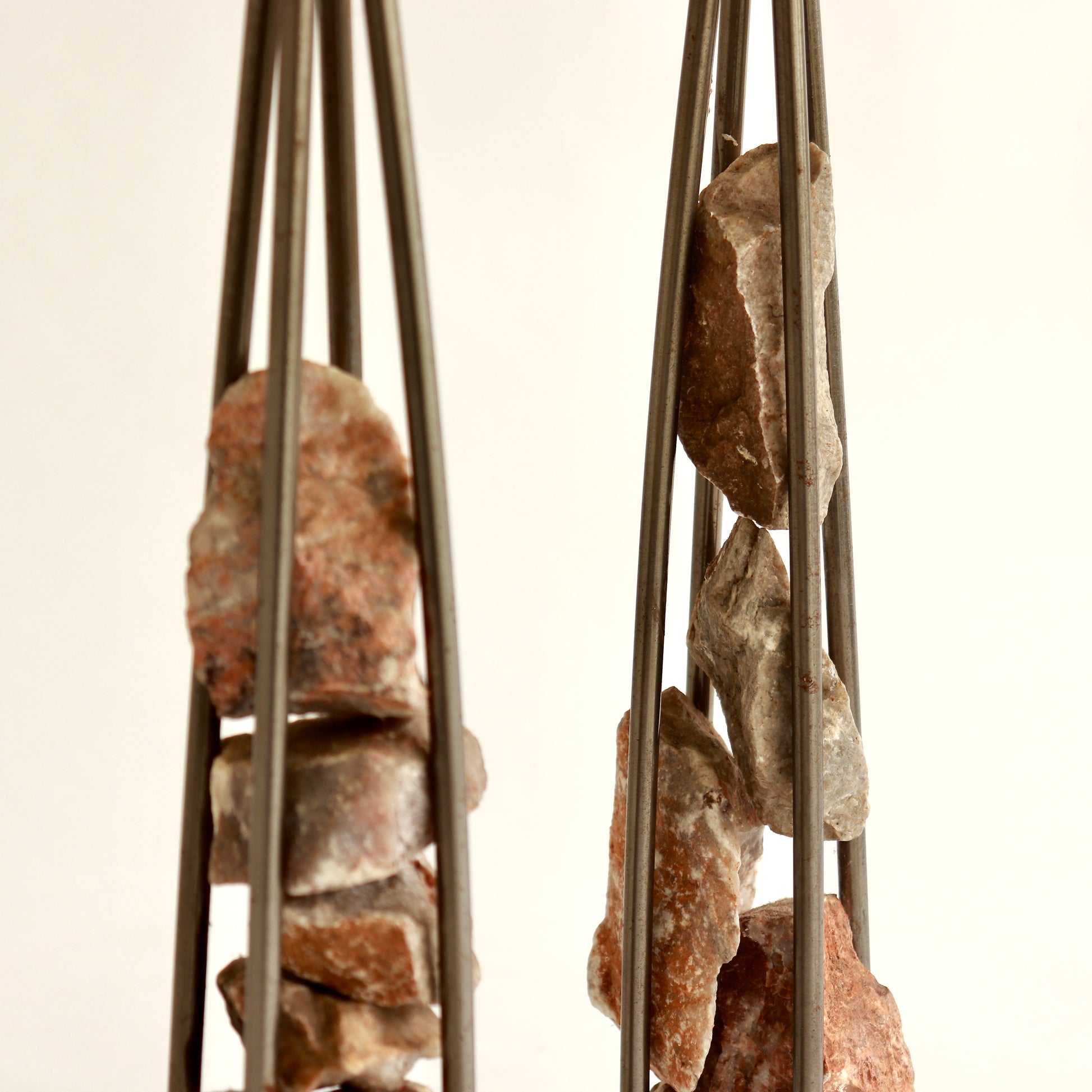 Sculptural candle holders with industrial steel frame

