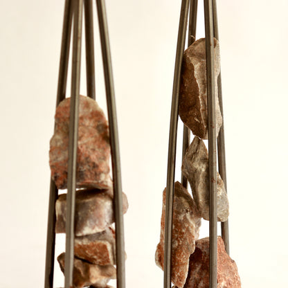 Sculptural candle holders with industrial steel frame
