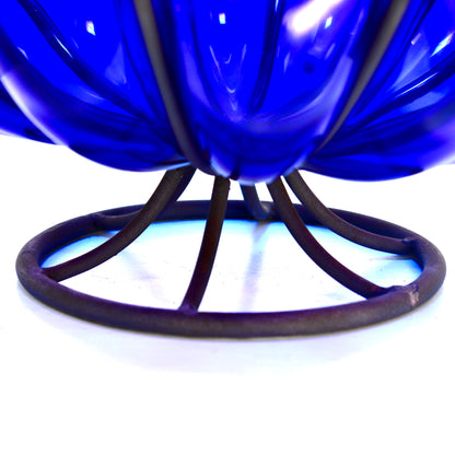 Deep blue glass decorative bowl in metal structure