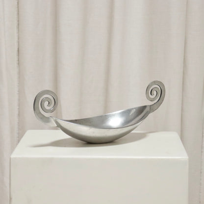 Front view of aluminium dish with twin volute handles.
