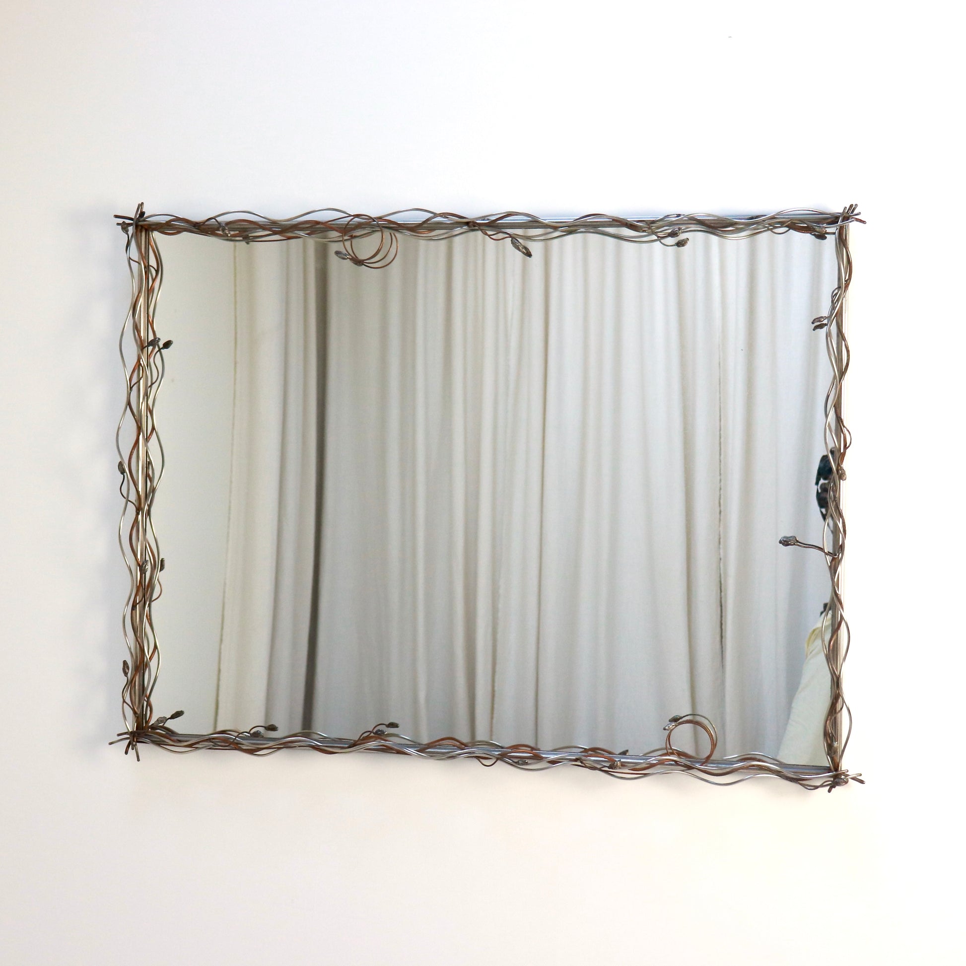 Late 20th-century stainless steel and copper sculptural wall mirror