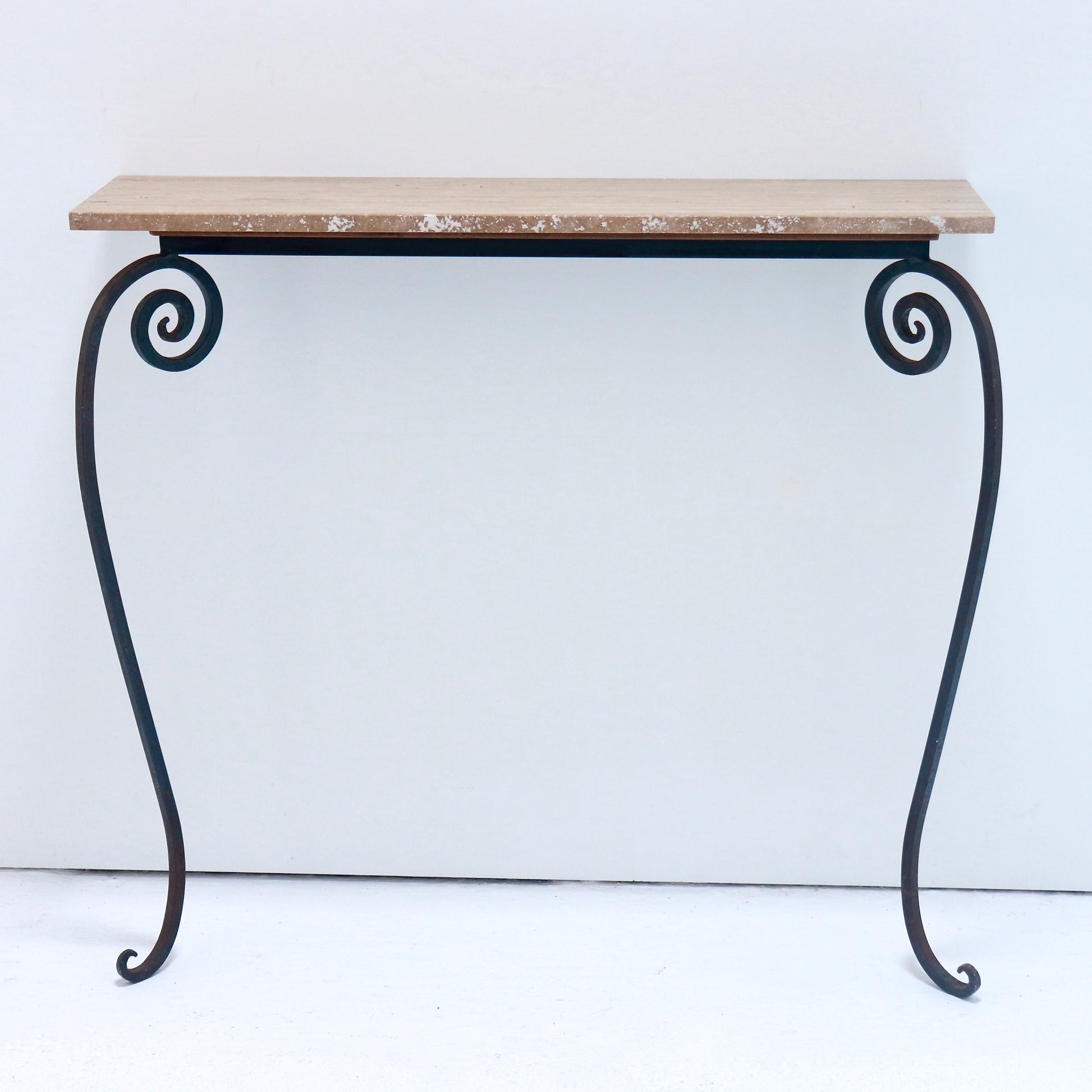 Wrought iron console with travertine stone top