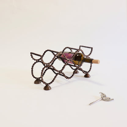 Handmade six bottle wine rack crafted from reclaimed bicycle chain