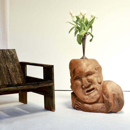 Hand-carved sculptural wooden side table with reclining figure