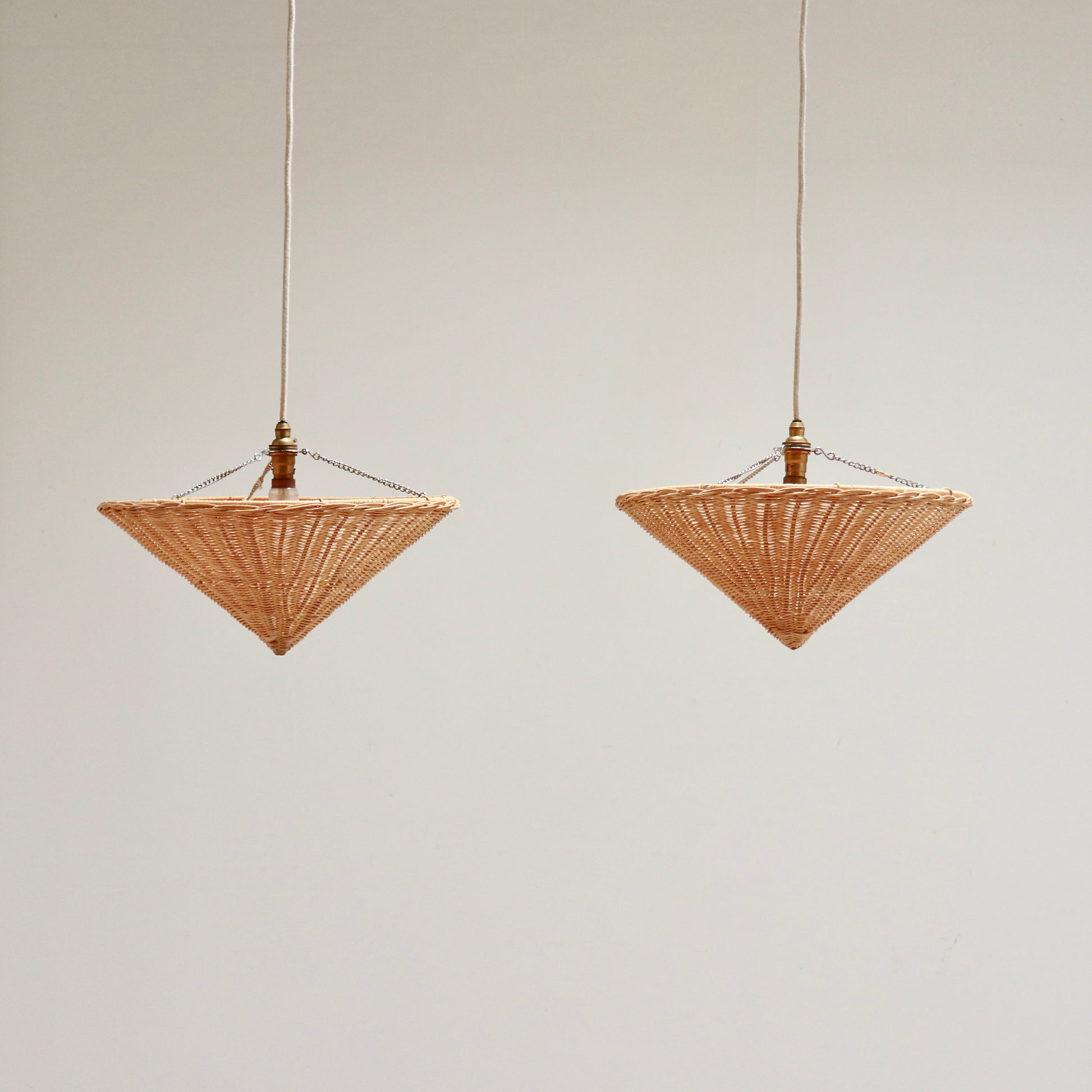 Pair of vintage rattan cone uplighter pendant lights hanging side by side