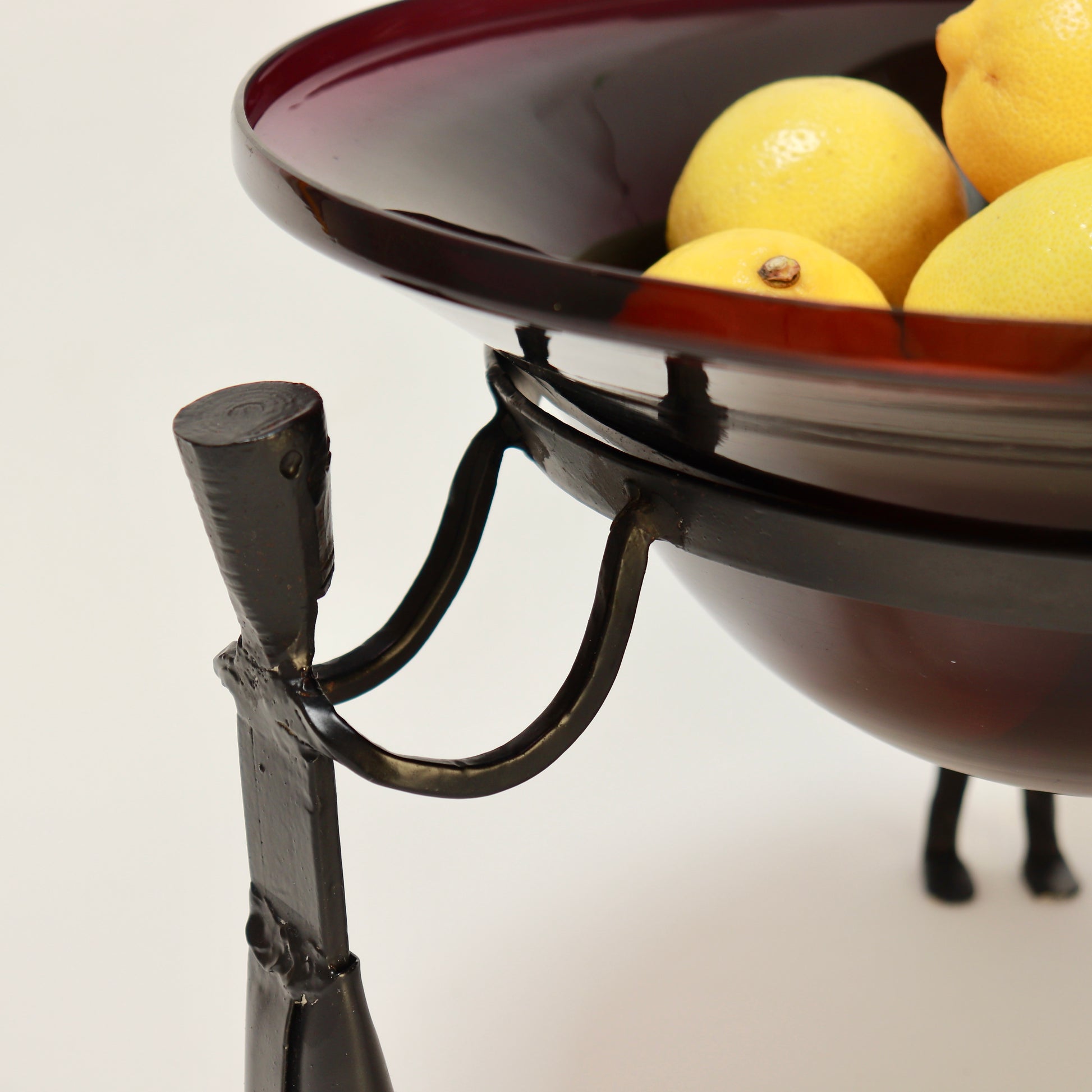 Late 20th century figural iron and glass fruit bowl