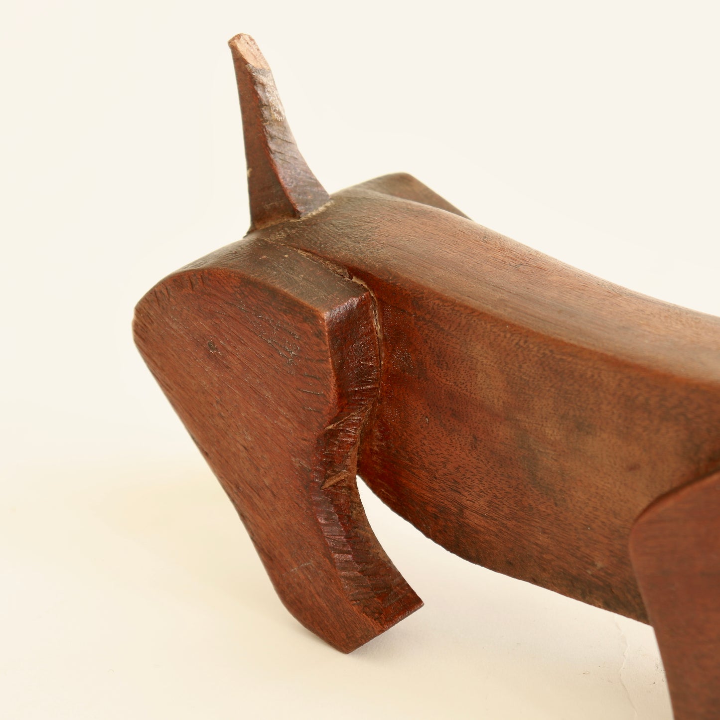 Wooden dachshund sculpture patina and grain detail
