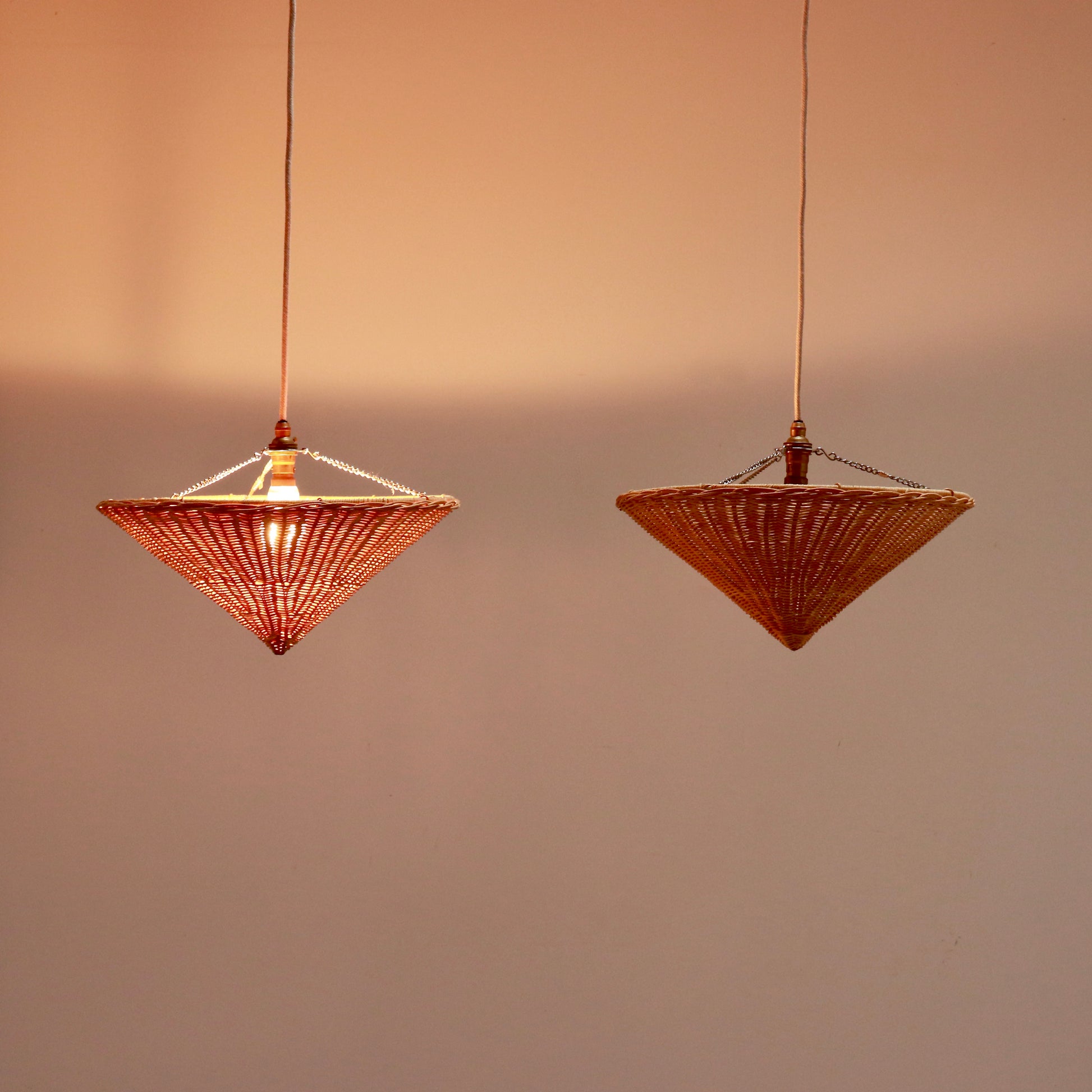 Rattan cone pendant uplighter showing warm woven texture and shape
