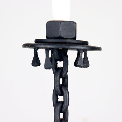 Close-up of forged drip tray with hanging iron details