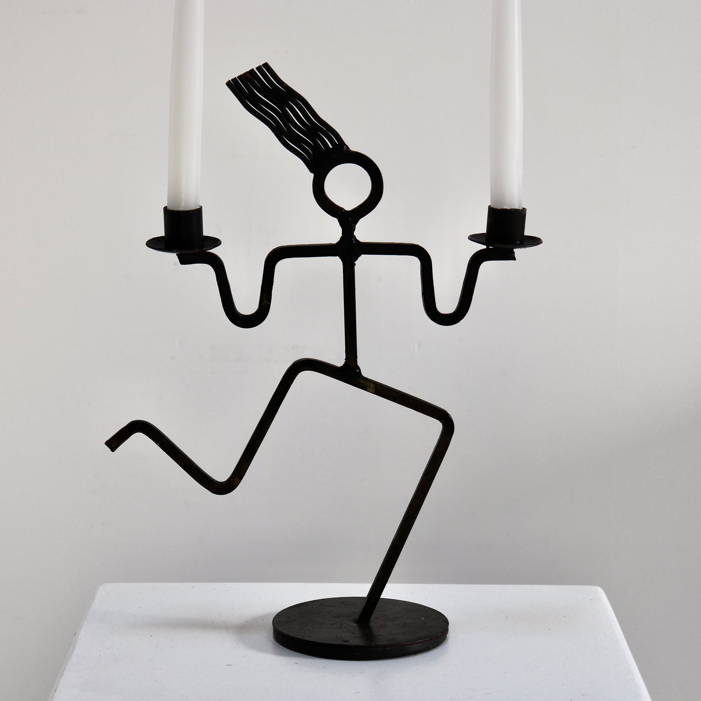 Sculptural welded iron twin candle holder