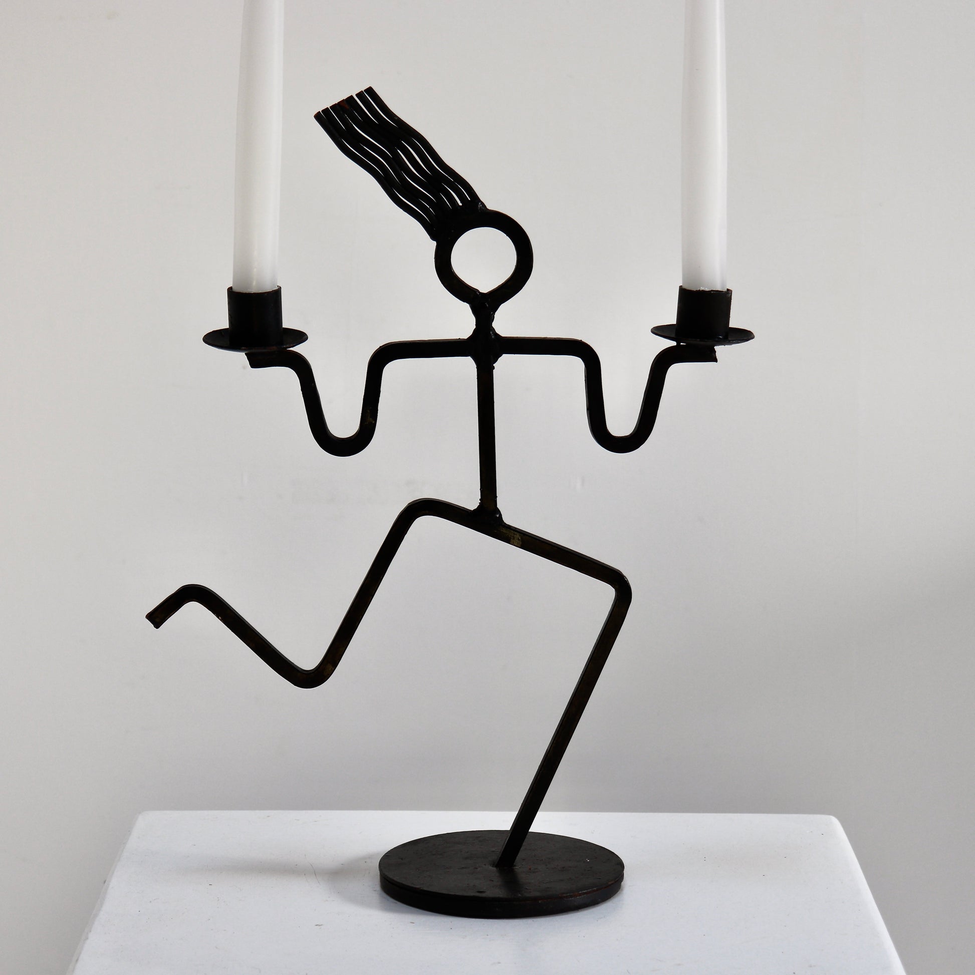 Sculptural welded iron twin candle holder