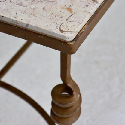 “Wrought-iron leg with scroll detail, vintage coffee table”