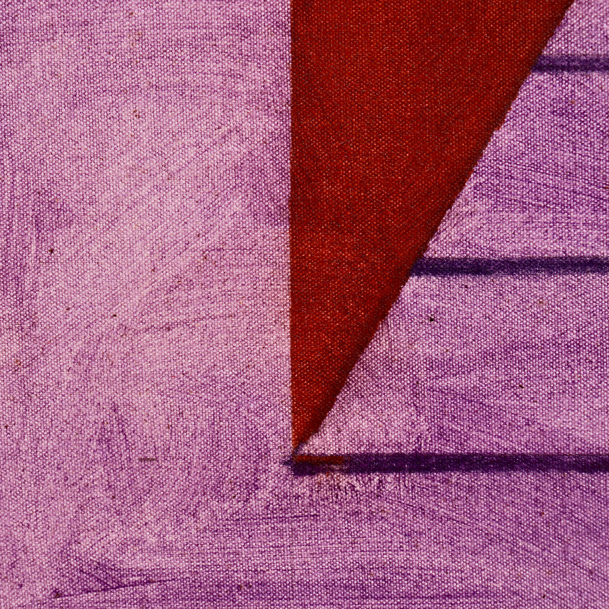 Close-up of canvas texture and violet brushwork where the pyramid’s lower left corner meets the red ground in John Mitchell’s painting.