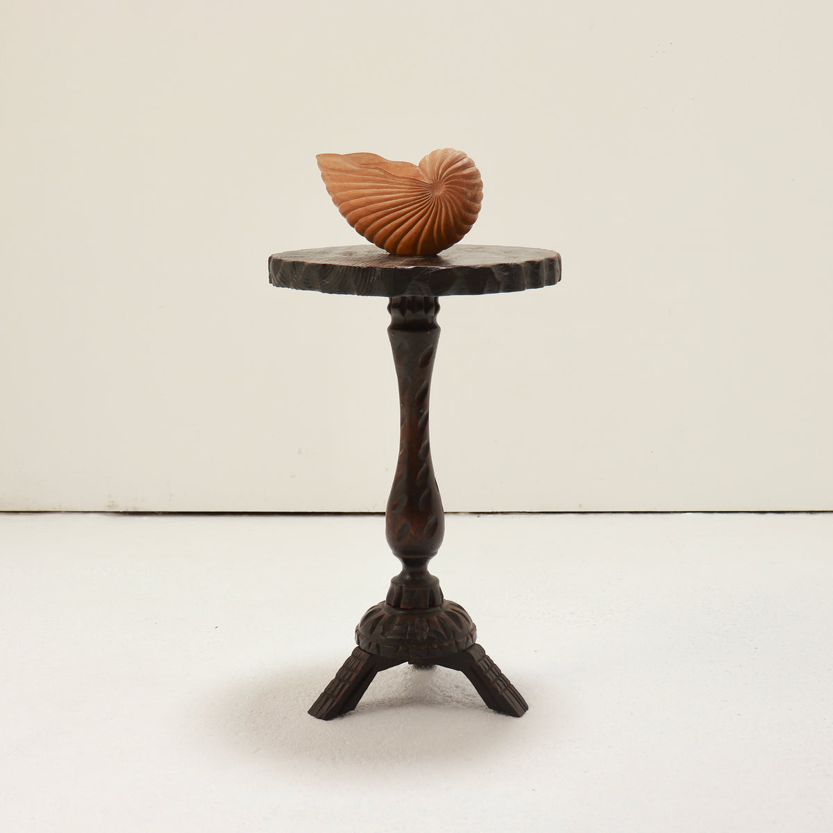 Spanish brutalist wooden pedestal side table with circular top and tripod base