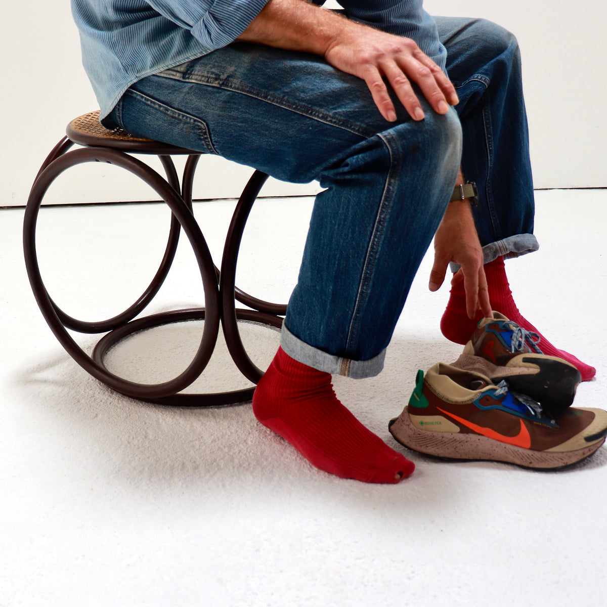 - Bentwood stool shown in use to illustrate its scale