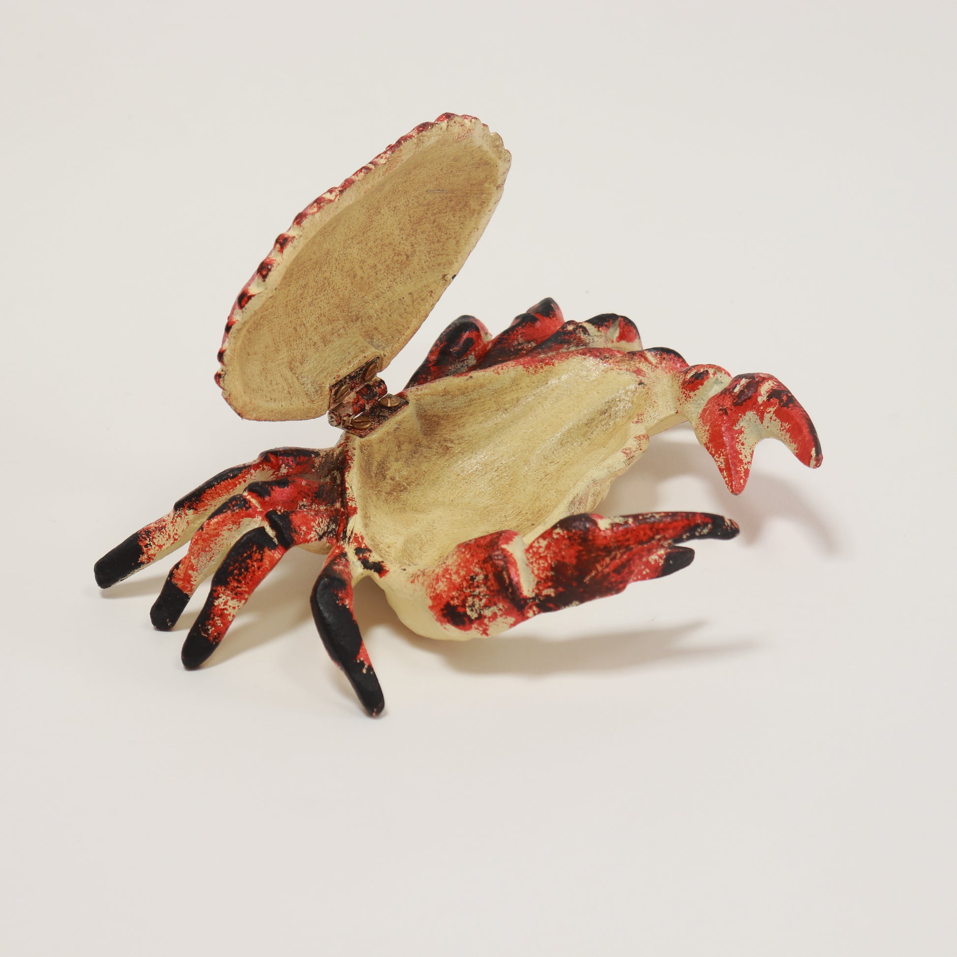 Red and black cast iron crab with hinged lid
