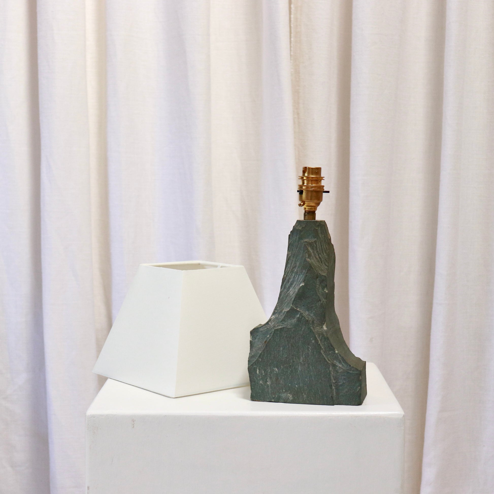 Slate table lamp with brass fitting and white shade