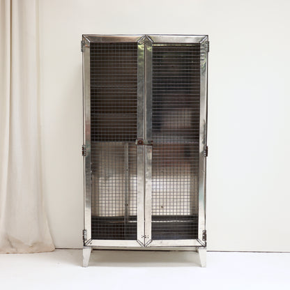 Vintage military aluminium cabinet with industrial mesh front.