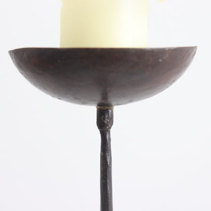 Antique forged iron candle stand with tripod base