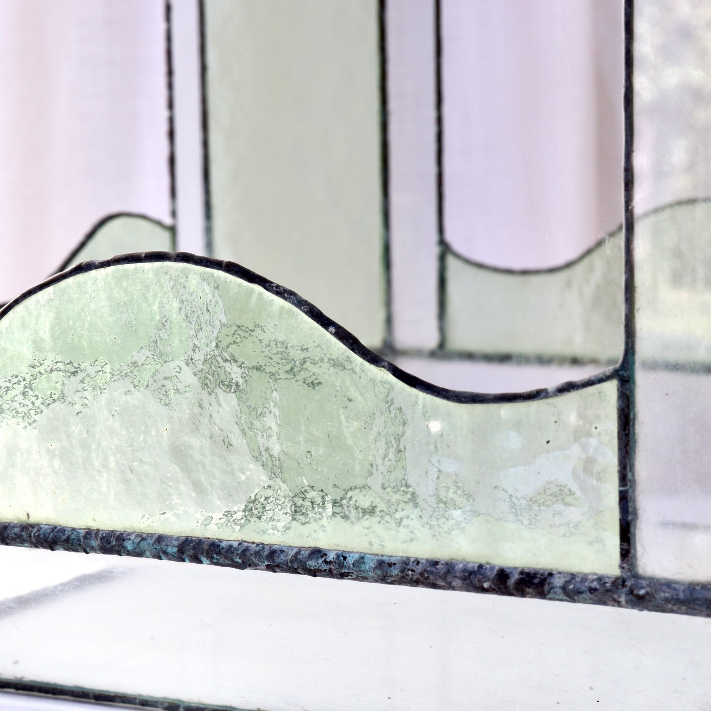 Decorative antique terrarium with pale green glazing