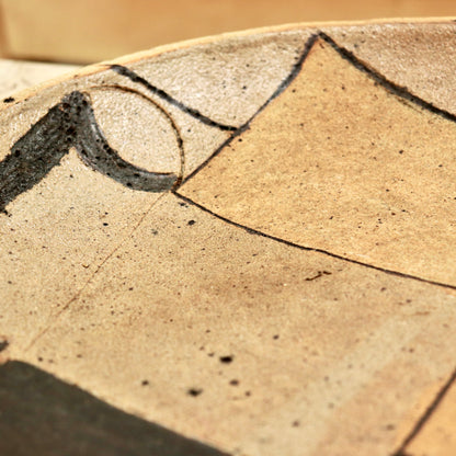 Close-up of abstract painted detail on studio pottery