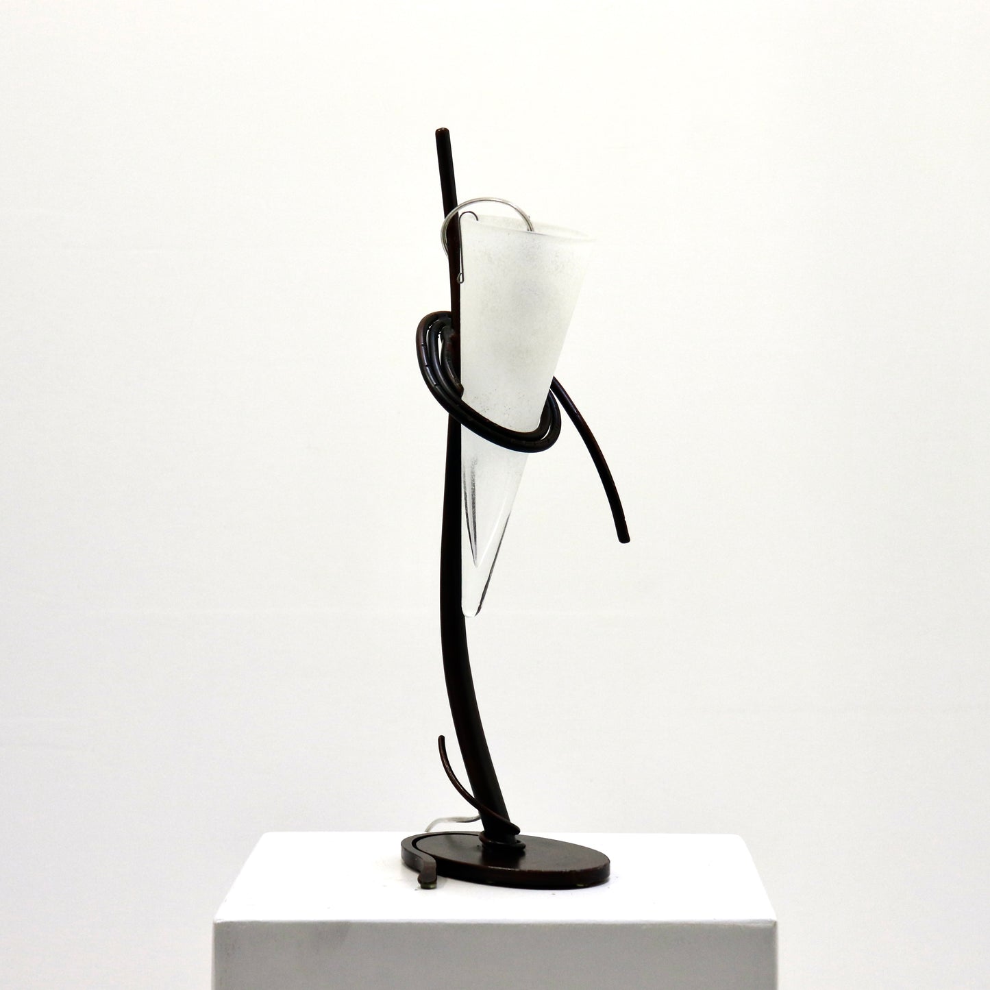 Single iron-and-glass lamp, side profile.