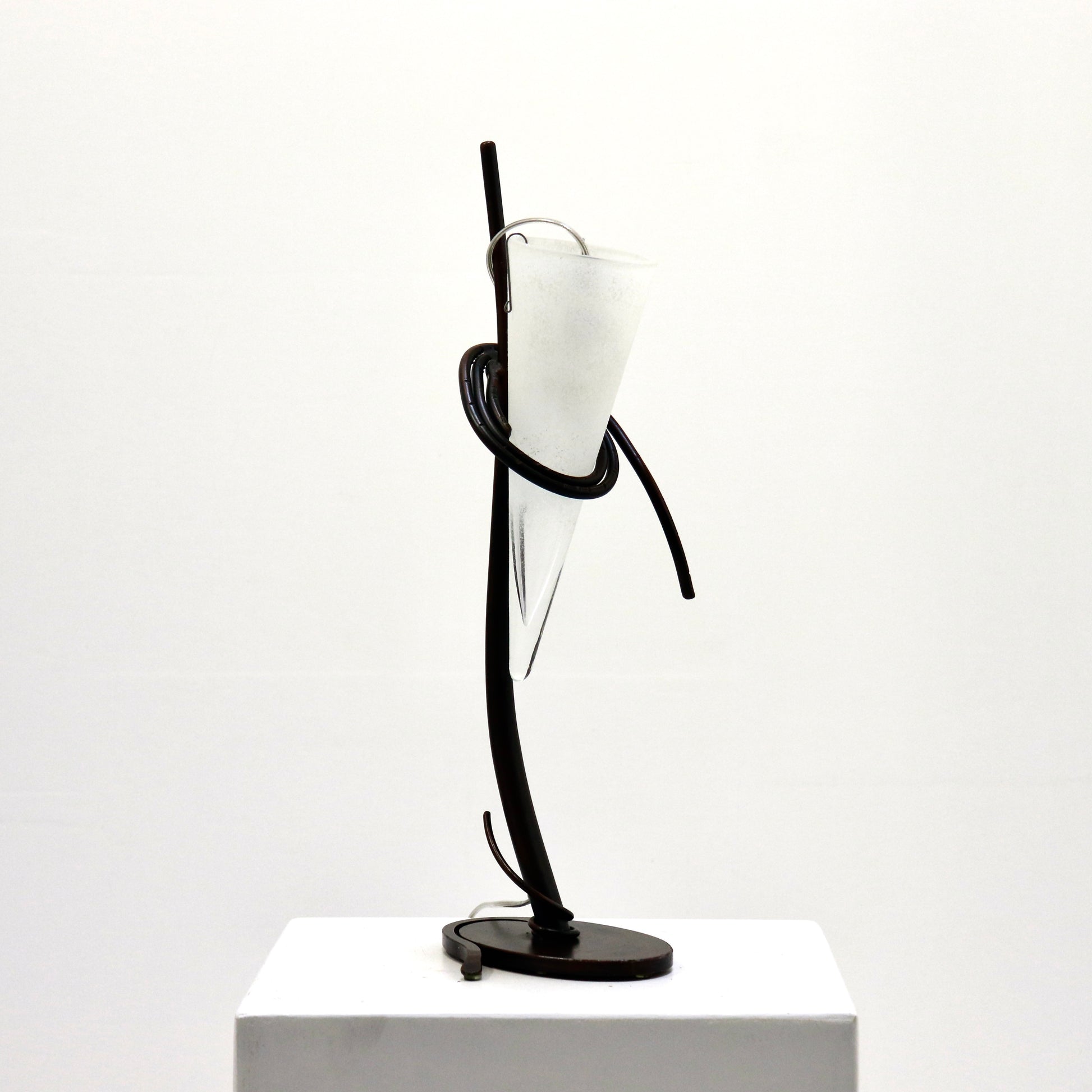 Single iron-and-glass lamp, side profile.