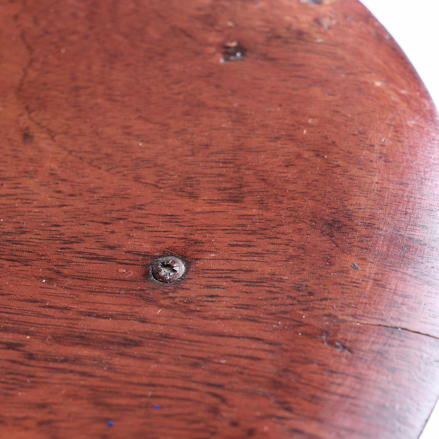 Patinated wood seat surface with visible grain