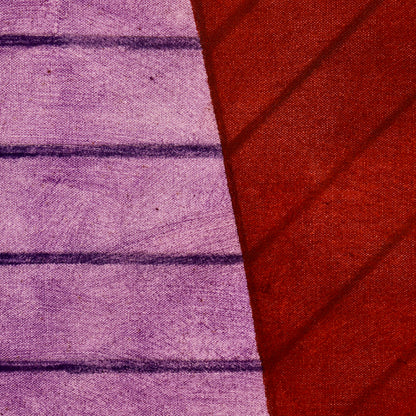 Close-up of dark horizontal and diagonal lines across violet and red painted planes in John Mitchell’s Square Pyramid, Capped.
