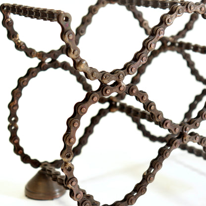 Close-up of reclaimed bicycle chain construction