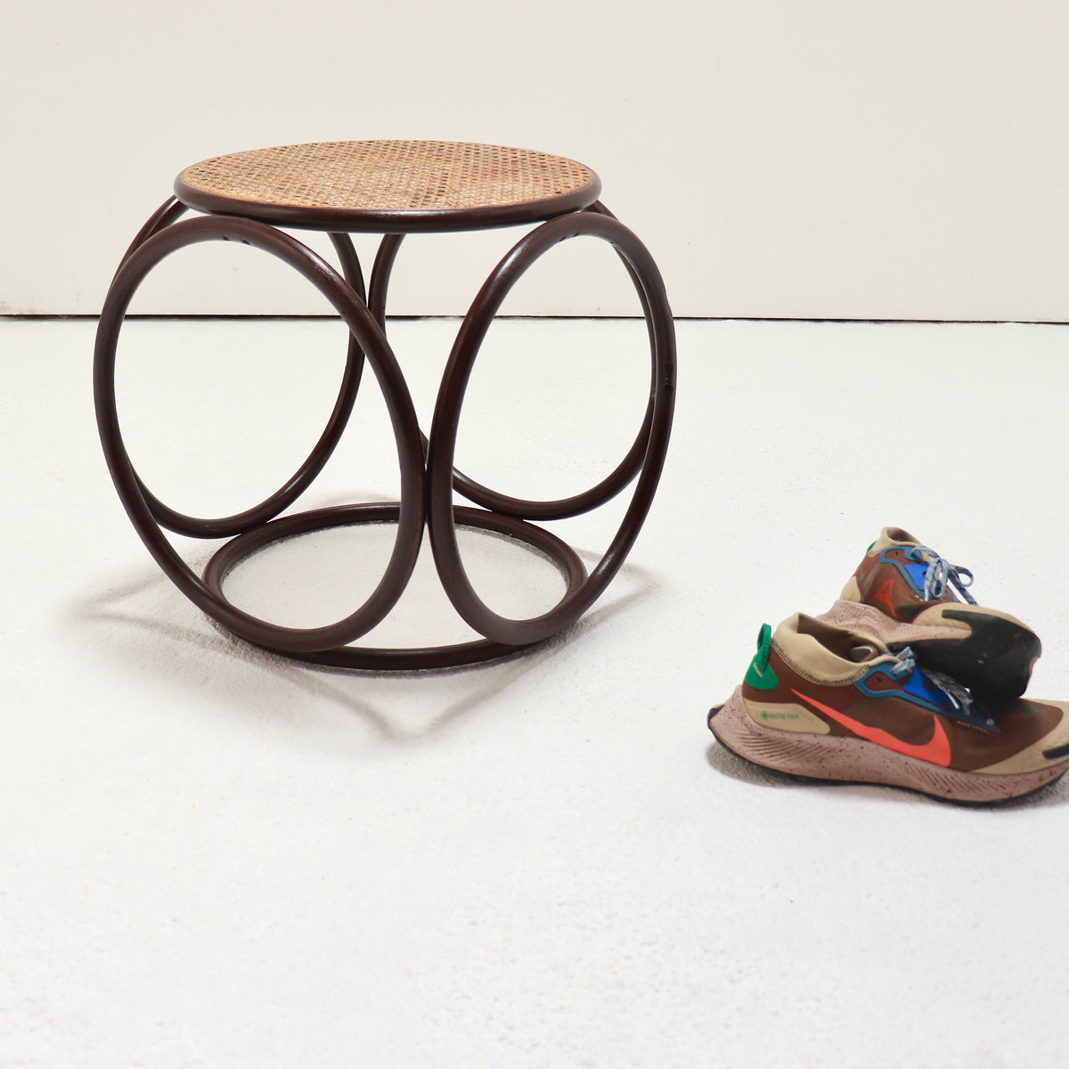 Vintage Thonet-style bentwood hoop stool with cane seat and burgundy lacquer