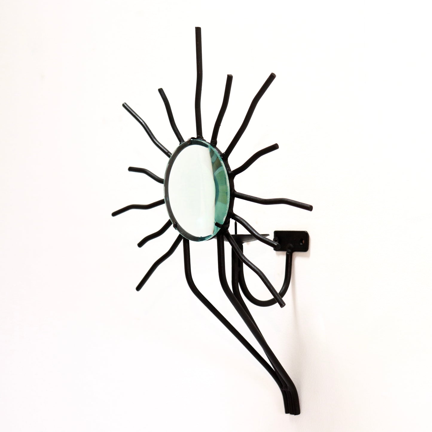 Sunburst wall sconces in the style of Andre Dubreuil